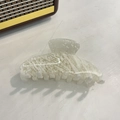 Detail shot of large acetate shark clip with creamy white marble texture and glossy finish - Creamy White Marble / 10.5cm