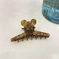 Close-up of acetate hair claw with mouse silhouette and golden star details - Small Mouse Head Silhouette