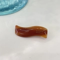 Minimalist amber wavy hair clip with gold SANSHINE Handmade lettering on white surface - Brown Jelly