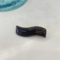 Detailed macro view of dark brown wavy resin hair clip with gold SANSHINE Handmade lettering - Coffee Jelly