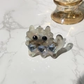 Close-up of marble resin cat hair clip featuring heart-shaped crystals and metallic detail - Duckbill Hair Clips / Gray