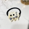 Detail of cartoon monster hair clip with iridescent heart crystals and creamy finish - Hair Tie / Nougat