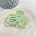 Detail of mint green acetate butterfly hair claw with hollow lines on ceramic tray - Blue and White (Approx 8.5cm)