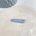 Detail of light blue acetate hair clip with gold France Handmade lettering on ceramic plate - Straight Duckbill Clip / Jelly Blue