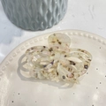 Close-up of cream tortoiseshell acetate butterfly hair claw clip on ceramic plate - Translucent Yellow Coffee (Approx 8.5cm)