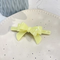 Close-up of a pale yellow double-layer acetate bow hair clip on a ceramic tray - Crooked 3D Bow (Approx 9cm) / Yellow Jelly