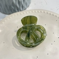 Close-up of dark green acetate hair claw clip with heart-shaped cross and silver rivets - Dark Green