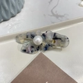 Detailed macro view of the marble blue acetate flower hair clip with pearl center - Translucent Black - Pearl Butterfly Duckbill Clip (Approx 5cm)