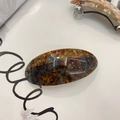 Detailed close-up of tortoise shell acetate hair clip with premium spring metal clasp - Oval Spring Clip / Blue Tortoise