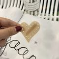 Detail of cream resin heart hair clip with white faux pearls for a sweet vintage style - Jelly Brown with Pearls