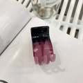 Detailed view of a small black and purple gradient hair claw clip on a white book surface - Rose Pink-Black Gradient
