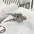 Detail of cicada hair claw clip featuring golden mesh veins and white marble pattern - Terrazzo Dragonfly Claw (Approx 6.5cm)