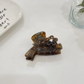 Detail of tortoiseshell hair claw with a crystal-centered flower on a minimal background - Rhinestone Flower (cszj22-0001) / Approx 6cm / Blue Tortoise
