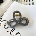 Elegant grey butterfly hair claw clip with strong gold spring on white magazine - Light Silver Grey