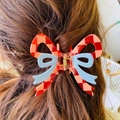 Pink and red checkered bow hair claw clip styled on long brown hair for sweet aesthetic - Checkerboard Red Dual-Color Bowknot