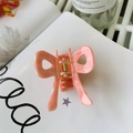 Detail of the elegant pink and cream acetate bow hair claw clip with golden metal spring - Apricot Pink Stripe - Bow Square Claw (6.8cm)