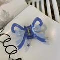 Close-up of dual-tone blue bow hair claw clip with metallic spring detail on magazine - Jelly Blue Dual-Color Bowknot