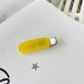 Detail view of a translucent yellow resin hair clip with a silver metal duckbill base - Yellow Jelly
