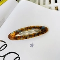 Detail of French vintage oval acetate hair clip with tortoise shell pattern and metal clip - Blue Tortoise