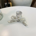 Detail of a pearlescent acetate bow hair claw clip with elegant gold lettering - Colorful Gray - Bow Streamer Claw Clip (Approx. 10cm)