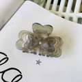 Close-up of butterfly hair claw clip in smoky grey acetate with iridescent pearl finish - Approx. 7.3cm / Gray Mermaid