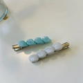 Elegant marble pattern hair clips in blue and white on a clean minimalist background - Blue