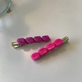 Detailed close-up of purple marble and pink resin hair clips with metallic duckbill base - Purple Rose Pink