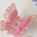 Détail de la pince à cheveux papillon rose avec strass colorés et ressort doré brillant - Environ 7cm / Rose Transparent
