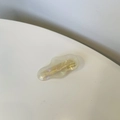 Handmade iridescent amber resin hair clip for women with gold logo on white background - Clear White