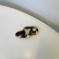 Close-up of irregular wave amber acetate hair clip with gold SANSHINE Handmade logo - Coffee Marble