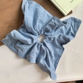 Detail of oversized blue and white gingham check scrunchie on rustic wooden background - Sky Blue Plaid