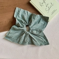 Close-up of green and white gingham fabric scrunchie with large bow detail on wooden surface - Grass Green Gingham