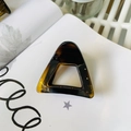 Elegant tortoiseshell triangle hair claw clip with cutout design on lifestyle magazine - Matte Light Tortoise