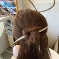 Minimalist white acetate hair pin in moon shape shown on a brown hair bun hairstyle - White Mermaid