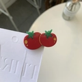 Detailed macro view of the glossy tomato-shaped hair clip with gold polka dots - Duckbill Hair Clips / Tomato