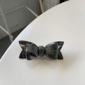 Detail of handmade acetate hair clip featuring dark green tortoise shell bow pattern - Gray (Gift Bow)