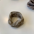 Detail of soft knitted neck gaiter featuring brown and beige diagonal stripes for winter - Light Coffee Striped