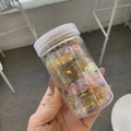 Bote de mini pompones de colores para proyectos de manualidades y accesorios de pelo - Caqui + Amarillo - Coleteros de Pompones de Colores
