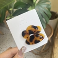 Detail of leopard print resin hair clips with rhinestones on a display card - Tortoiseshell