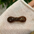 Detail of amber brown acetate bow hair clip with gold France Handmade lettering - Brown