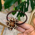 Detail of leopard print flower hair tie with rhinestones on a high elasticity brown rope - Brown Bead Leopard Flower Rhinestone Hair Tie