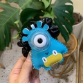 Detail of colorful faux leather monster hair scrunchie with a large white eyeball decor - Blue One-Eyed Monster