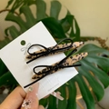 Sweet leopard print bow hair clips set on display card with green leaf background - Leopard Print Shuttle Shape Bow Clip