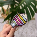 Detail of fish-shaped acetate hair claw with colorful stripes and pearlescent finish - Colorful Tricolor Fish