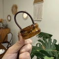 Close-up of dual amber acrylic rings on a high-elastic brown hair tie for women - Double Layer Oval / Americano