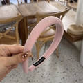 Detail showing the pink padded sponge headband with a black handmade woven label - Light Pink