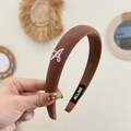 Detailed shot of brown velvet headband with pink embroidered letter A and brand tag - Suede Style Headband / Letter A Red Brown Headband
