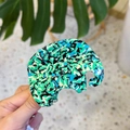 Detail of elephant-shaped hair claw clip with colorful mosaic acetate textures - Forest Green Elephant