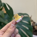 Close-up of a mini yellow acrylic stationery clip in a cute cartoon brush shape - Mini Art Brush