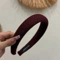Detail of burgundy knitted headband featuring a handmade label on the inner black fabric - Dark Red Diagonal Stripe Headband